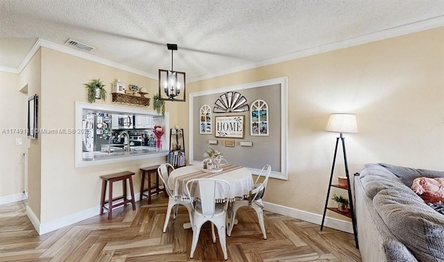 10927 NW 29th Ct, Sunrise, FL 33322 - dining room featuring ornamental molding, visible vents, a textured ceiling, and baseboards