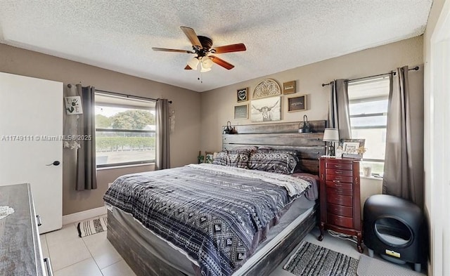 10927 NW 29th Ct, Sunrise, FL 33322 - bedroom with ceiling fan, baseboards, a textured ceiling, and light tile patterned flooring