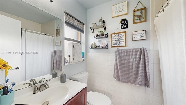 10927 NW 29th Ct, Sunrise, FL 33322 - full bath featuring toilet, vanity, and tile walls