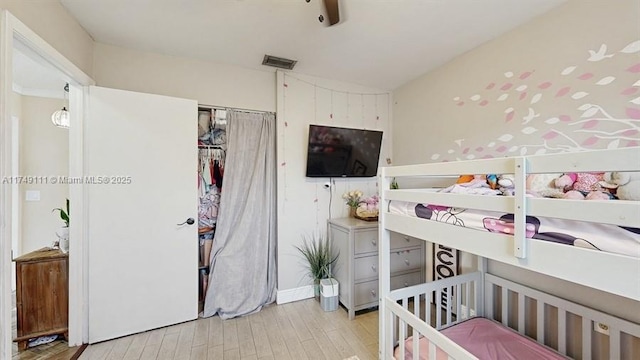 10927 NW 29th Ct, Sunrise, FL 33322 - bedroom featuring a closet, visible vents, light wood-style flooring, and baseboards