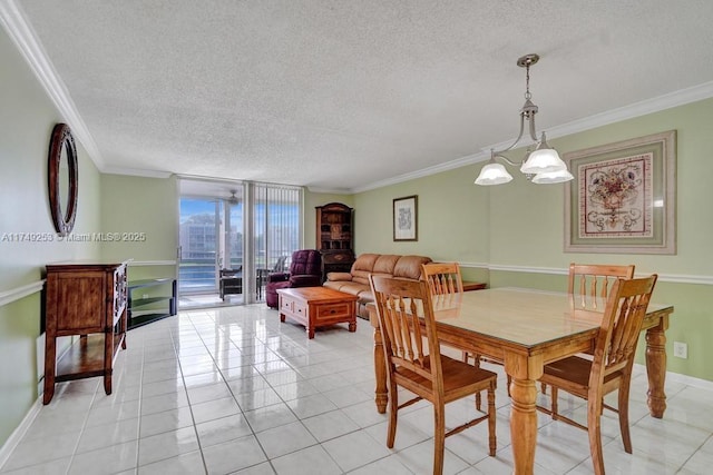 dining space featuring a textured ceiling, ornamental molding, light tile patterned floors, and floor to ceiling windows