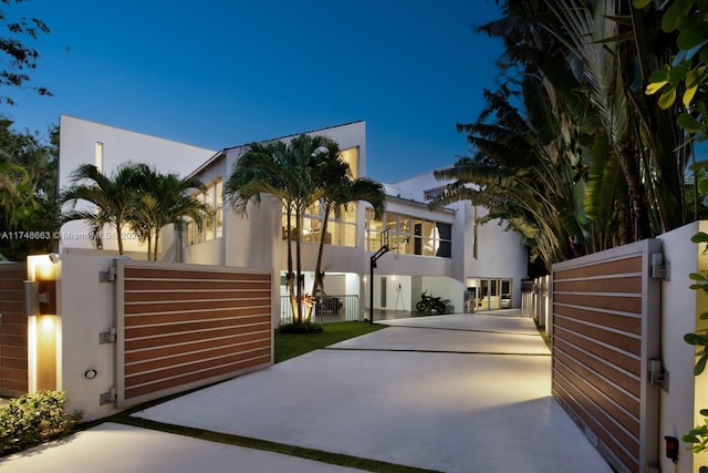 144 N Prospect Dr, Coral Gables, FL 33133 - view of front of house featuring a gate and stucco siding