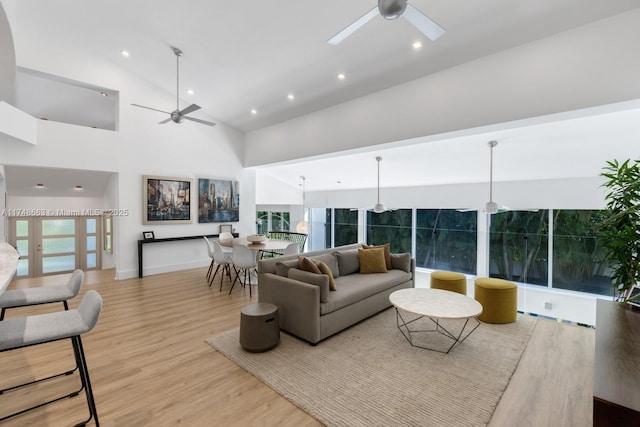 144 N Prospect Dr, Coral Gables, FL 33133 - living room with a ceiling fan, wood finished floors, high vaulted ceiling, and recessed lighting