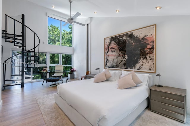 144 N Prospect Dr, Coral Gables, FL 33133 - bedroom with high vaulted ceiling, multiple windows, wood finished floors, and recessed lighting