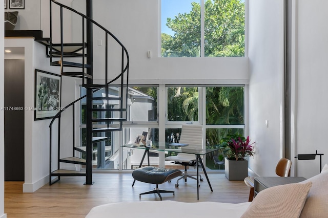 144 N Prospect Dr, Coral Gables, FL 33133 - living room with a high ceiling, wood finished floors, and stairs