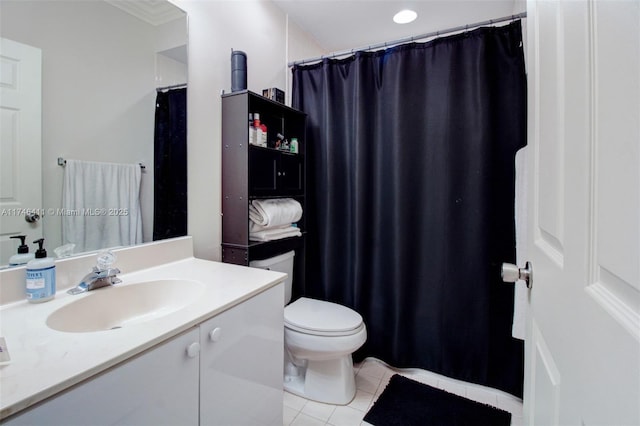 bathroom featuring toilet, vanity, and tile patterned floors