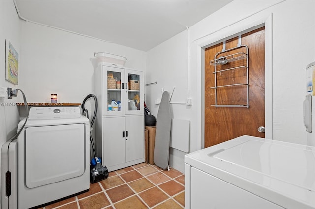 laundry area featuring laundry area, independent washer and dryer, and tile patterned floors