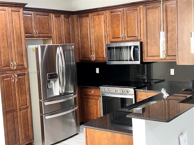 kitchen with tasteful backsplash, dark stone counters, appliances with stainless steel finishes, a peninsula, and light wood-type flooring