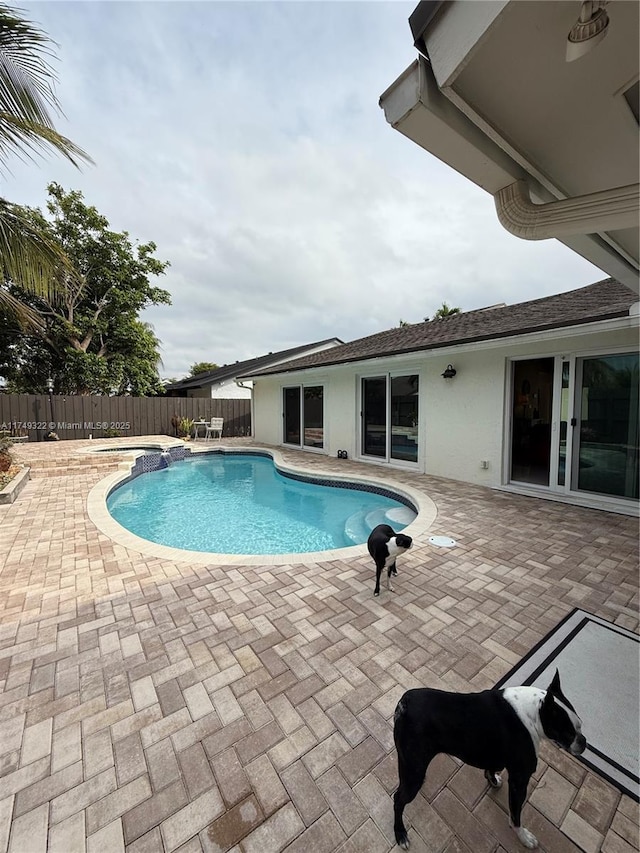 view of pool featuring a patio area, fence, and a fenced in pool