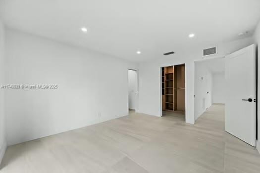 unfurnished room featuring visible vents and recessed lighting