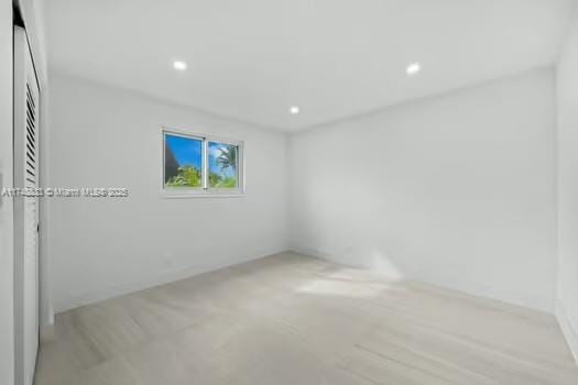 unfurnished room with recessed lighting