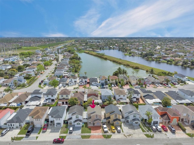 bird's eye view featuring a residential view and a water view