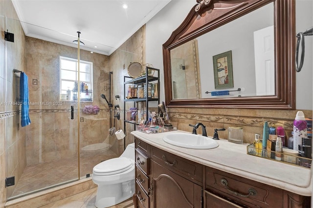 bathroom with toilet, ornamental molding, a stall shower, and vanity