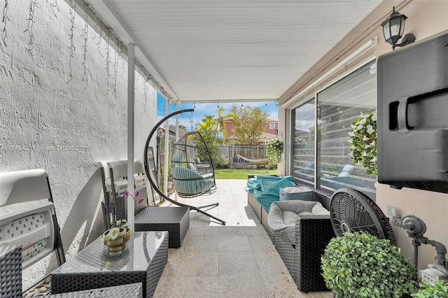 view of patio featuring fence and an outdoor living space