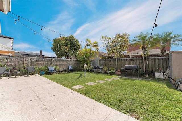 view of yard featuring a patio area and a fenced backyard