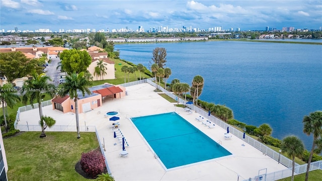 birds eye view of property featuring a view of city and a water view