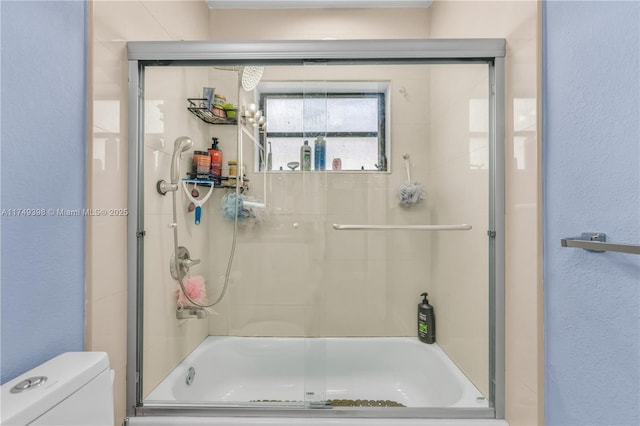1820 N 27th Ave, Hollywood, FL 33020 - full bath featuring combined bath / shower with glass door, a textured wall, and toilet