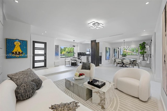 living room with recessed lighting and a chandelier