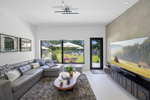 living area featuring a ceiling fan, light tile patterned floors, and recessed lighting
