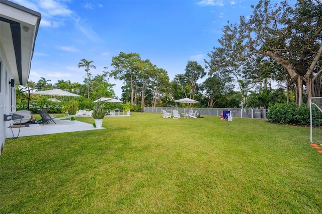 view of yard with a patio and fence