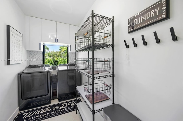 clothes washing area featuring laundry area and washing machine and clothes dryer