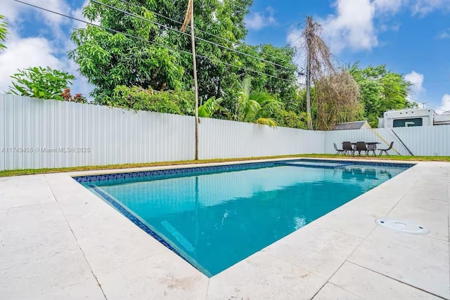 view of pool featuring a patio, a fenced backyard, and a fenced in pool