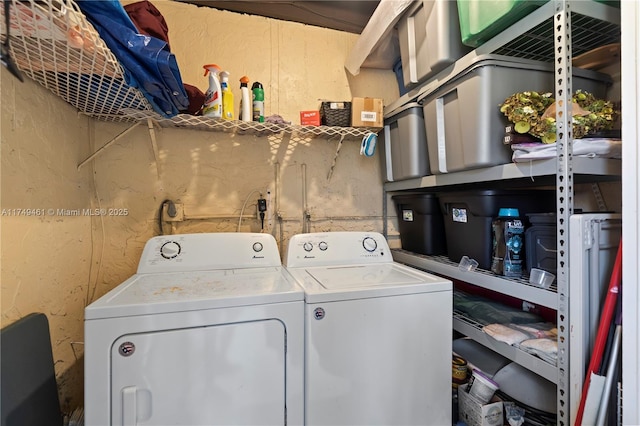 laundry room with laundry area and washing machine and clothes dryer