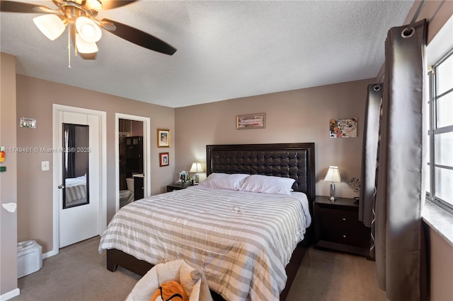 bedroom with a textured ceiling, carpet floors, and a ceiling fan