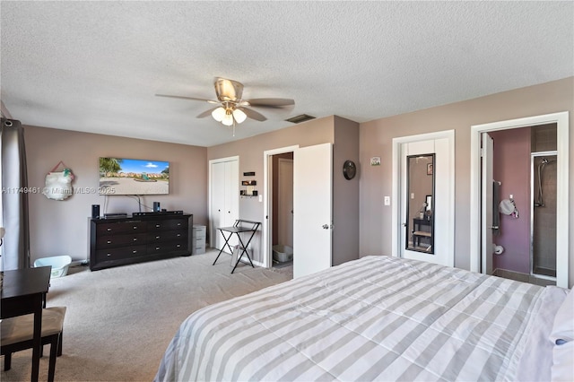 bedroom featuring light colored carpet, visible vents, ceiling fan, and a textured ceiling