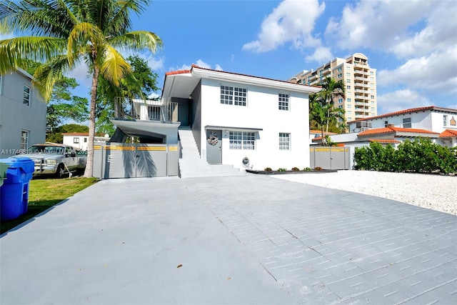 view of front of property featuring driveway and stucco siding