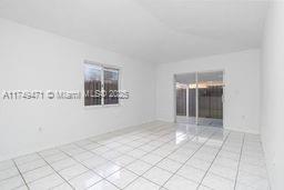 unfurnished room with light tile patterned floors