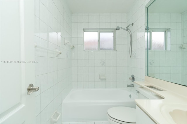 full bathroom featuring toilet, shower / bath combination, plenty of natural light, and vanity