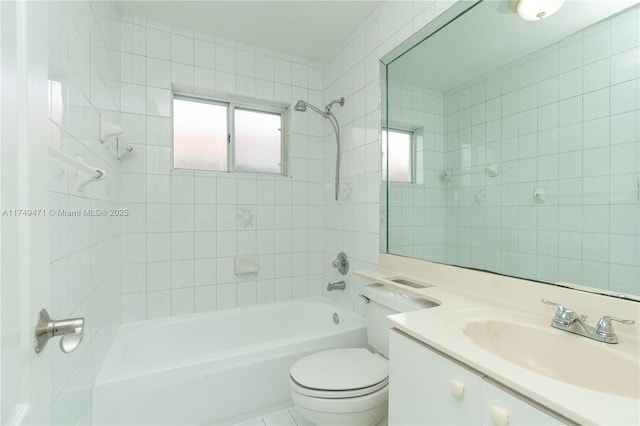 bathroom featuring toilet, shower / washtub combination, and vanity