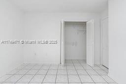 empty room featuring light tile patterned floors