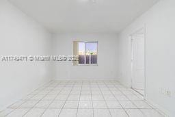 empty room featuring light tile patterned flooring