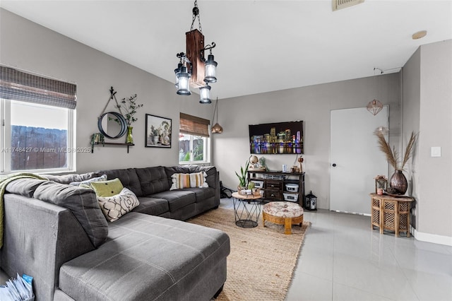 living room with visible vents and light tile patterned floors