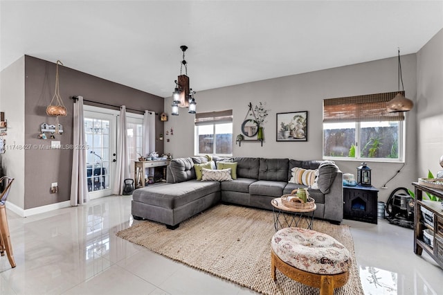 living area featuring baseboards