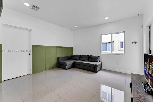 living area with light tile patterned flooring, baseboards, visible vents, and recessed lighting