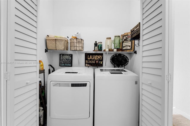 laundry room with laundry area and washing machine and clothes dryer