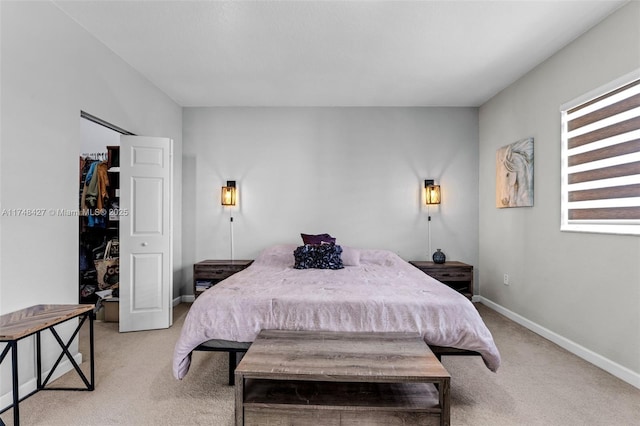 bedroom with light carpet and baseboards