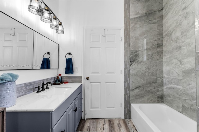 full bath featuring vanity and wood finished floors