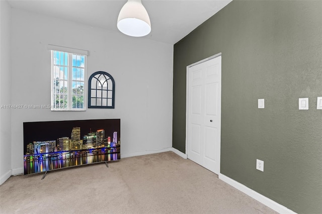 playroom featuring carpet floors and baseboards