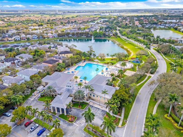 bird's eye view featuring a residential view and a water view