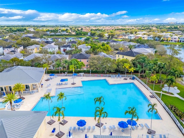 pool featuring a residential view and a patio