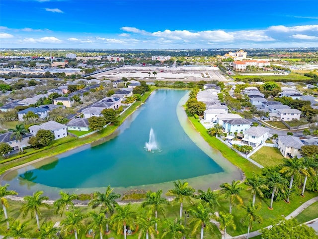 drone / aerial view featuring a water view and a residential view