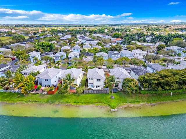 birds eye view of property with a residential view and a water view