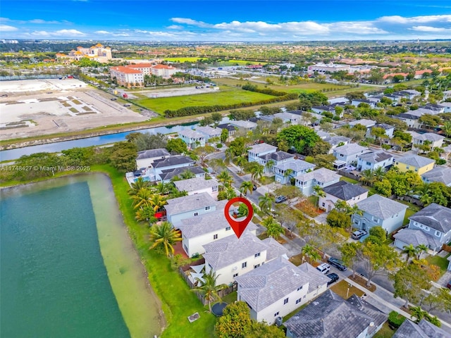 bird's eye view with a water view and a residential view