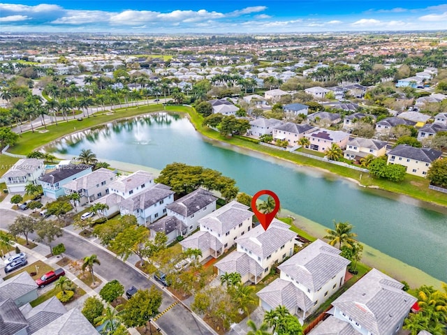 bird's eye view featuring a water view and a residential view