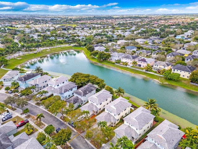 bird's eye view featuring a water view and a residential view