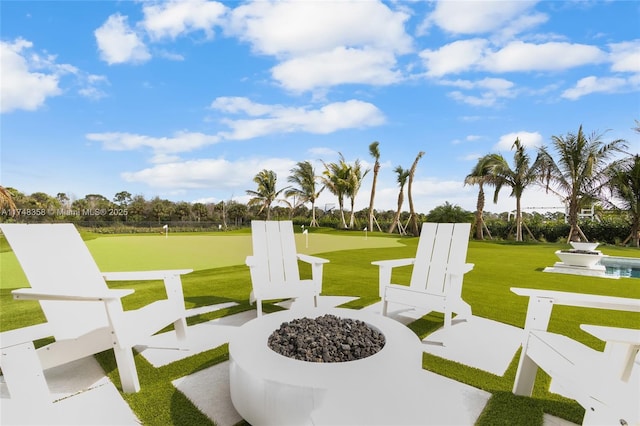 view of patio / terrace featuring an outdoor fire pit